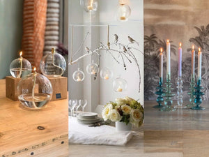 Collage van 3 fotos met olielampen hangende terrarium en glaskandelaren - WinQ