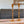 2 stuks glazen kandelaar metallic goud 10x25cm op houten tafel 