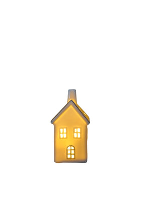 kersthuisje van porselein met schoorsteen en een ledlampje in