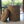 Opbergmand Abaca 40x49cm Beige op een veranda op een witte vloer met bos op de achtergrond