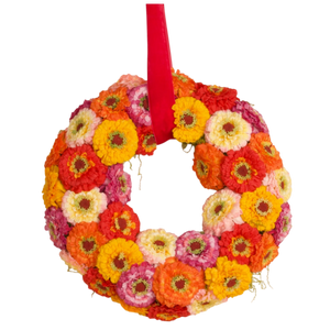 Ronde krans met kunstbloemen in rood, geel, oranje en roze aan rood lint, decoratief