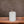 Metallic off white 7x10cm olielamp in een cilinder vorm op een houten tafel