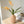 Sfeerfoto Metalen vaas zinnia met een geribbeld oppervlak in de kleur beige en hoogte van 38cm met kunsttakken - WinQ