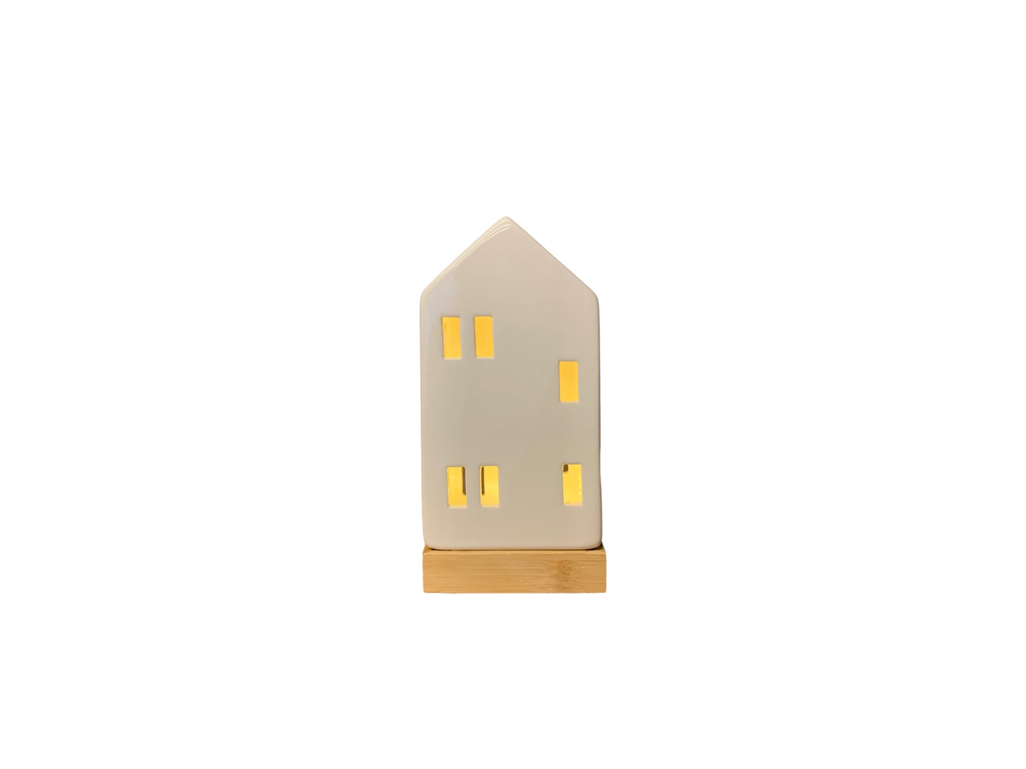 Wit kersthuisje van keramiek met een lampje en een houten voet